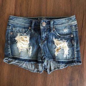 Silver jean shorts with gold sequin embellishments